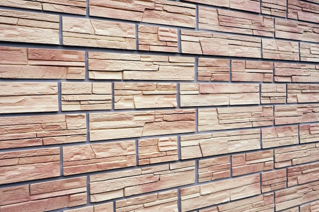 A Decorative Stone Artificial Wall In The Form Of Red Bricks