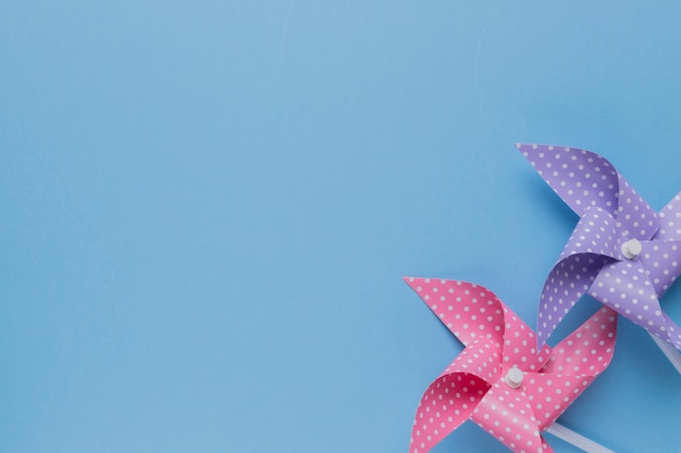 Free Photo | Decorative two polka dotted pinwheel on blue backdrop