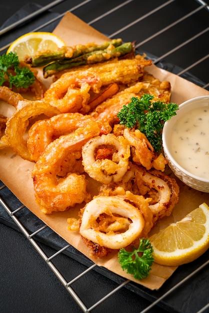 Premium Photo | Deep fried seafood (shrimps and squid) with mix ...