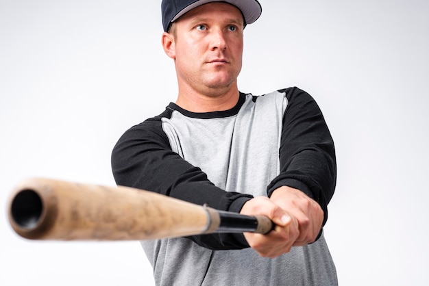 Free Photo Defocused Close Up Of Baseball Bat With Player