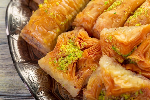 Premium Photo | Delicious baklava dessert in oriental bronze setting ...