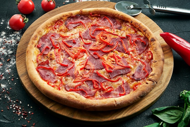 Premium Photo Delicious Close Up View On Spicy Sliced Pizza With Ham Onion And Chili Traditional Italian Cuisine