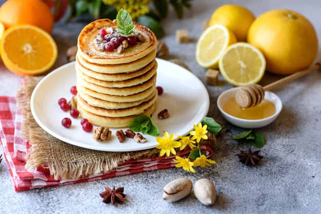 https://image.freepik.com/free-photo/delicious-fresh-beautiful-pancakes-with-citrus-honey-and-jam-delicious-hot-breakfast-with-pancakes-with-fruit-and-berries_73989-10051.jpg