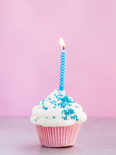 Free Photo | Delicious muffin with blue candle