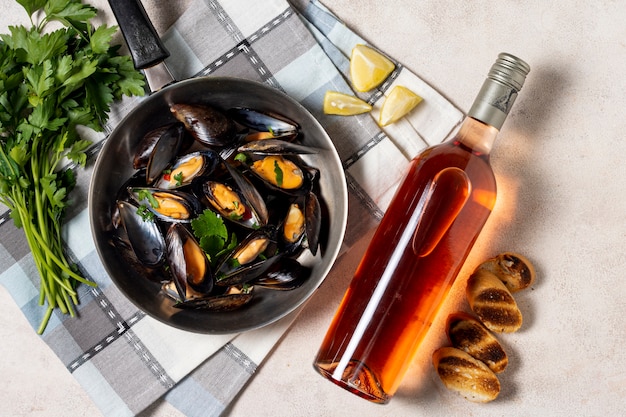 Free Photo | Delicious mussel with bottle of wine