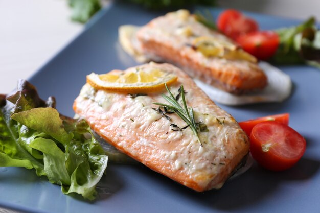 Premium Photo | Delicious roasted salmon fillets on plate