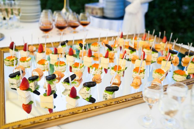 Premium Photo | Delicious snacks on wedding reception table in luxury