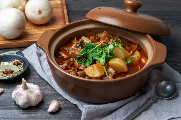 Premium Photo | Delicious stewed mutton with radish in casserole