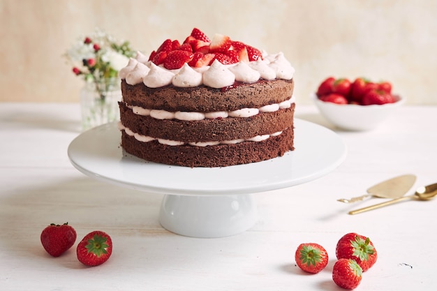 Delicious and sweet cake with strawberries and baiser on a plate Free Photo