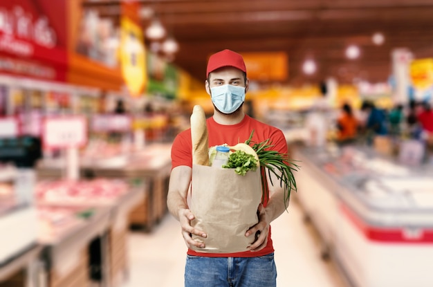 Delivery company worker holding grocery box, food order, supermarket service Premium Photo