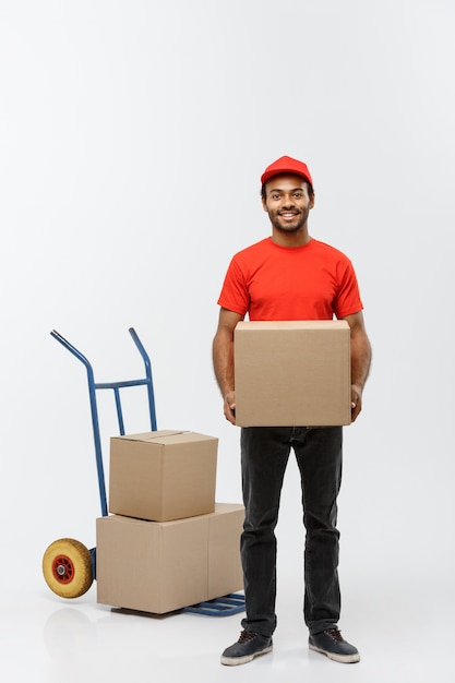 Delivery Concept Portrait Of Handsome African American Delivery Man Or Courier Pushing Hand