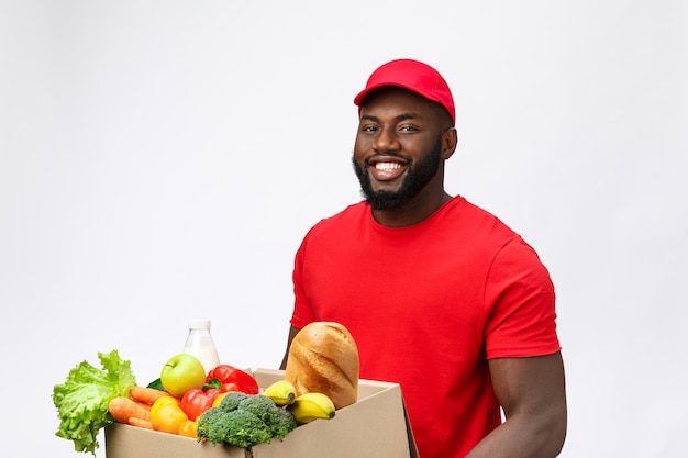 Premium Photo Delivery Service Handsome African American Delivery Man Carrying Package Box 5893