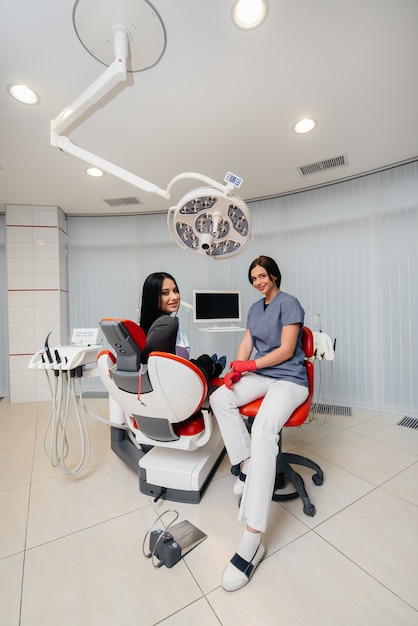 Premium Photo | The dentist conducts an examination and consultation of ...