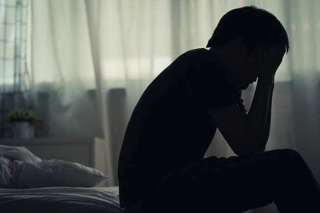 Premium Photo Depressed Lonely Man Sitting Alone On The Bed