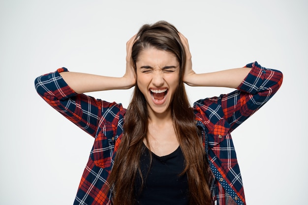 Free Photo | Depressed woman shut ears and screaming