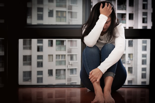 Premium Photo Depressed Women Sitting Near Window Alone Sadness