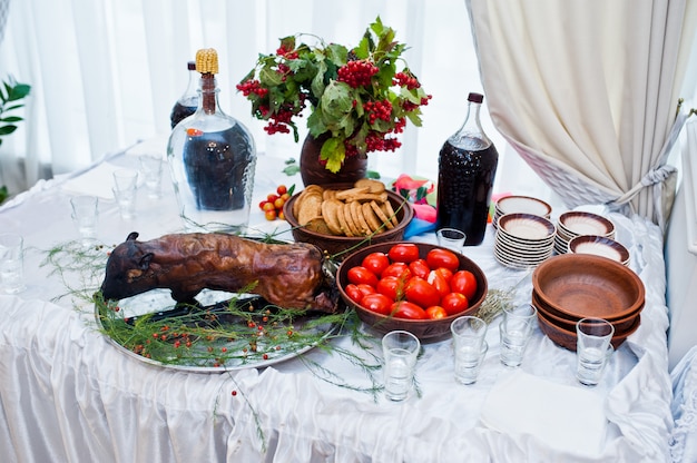 Dessert Table Of Delicious Snacks With Roasted Pig On Wedding