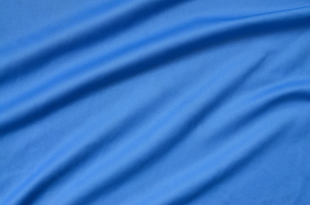 Detailed polyester blue fabric texture with many folds | Premium Photo