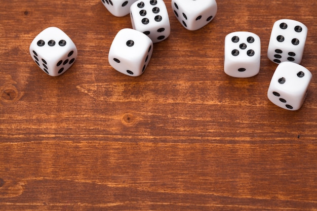 Dice on wooden table. for casino games. Premium Photo