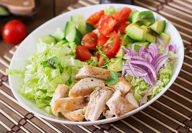 Free Photo Dietary Salad With Chicken Avocado Cucumber Tomato And Chinese Cabbage