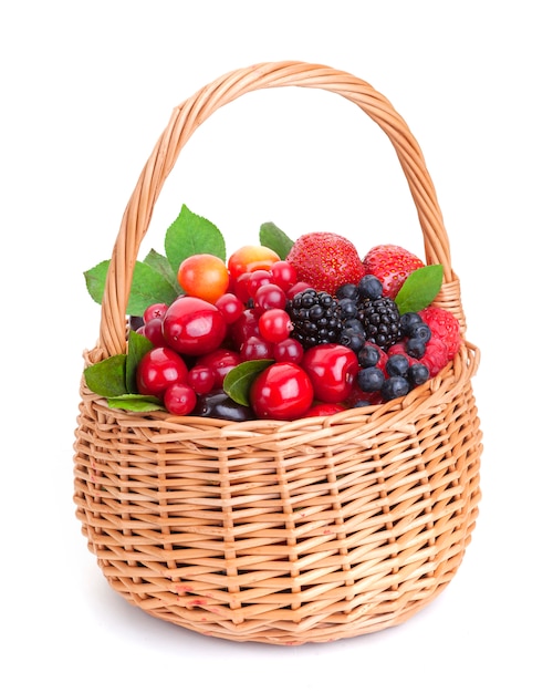 Premium Photo | Different berries in basket on white background