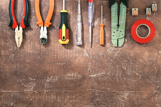 Premium Photo | Different electrical tools on light brown background ...