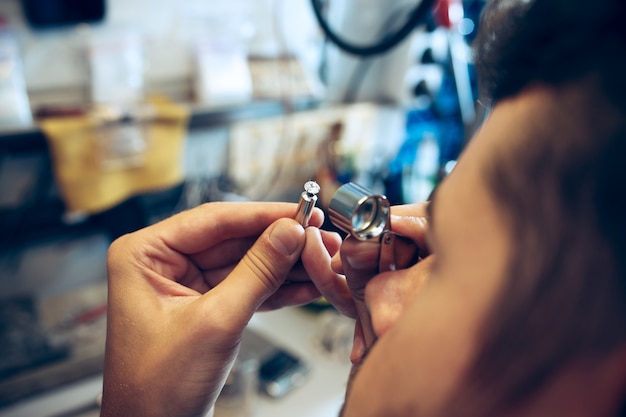 Different Goldsmiths Tools On The Jewelry Workplace. Jeweler At Work In ...