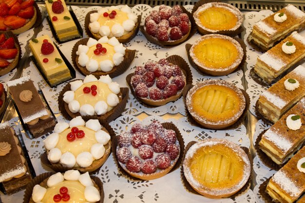 Premium Photo | Different sort of beautiful pastry, small colorful ...