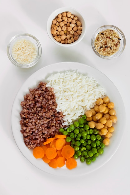 Free Photo | Different types of porridge with vegetables on plate with ...