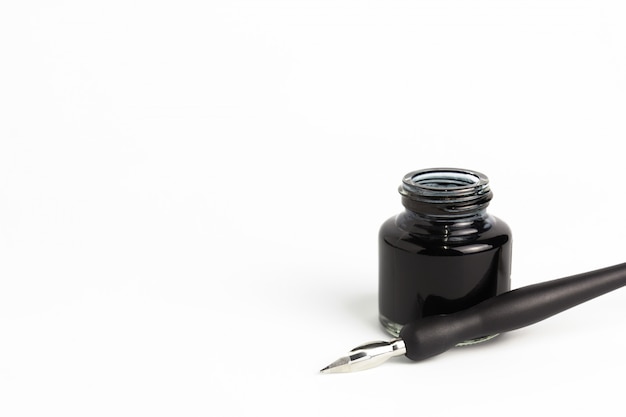 Premium Photo | Dip pen and bottle of ink on isolated white background