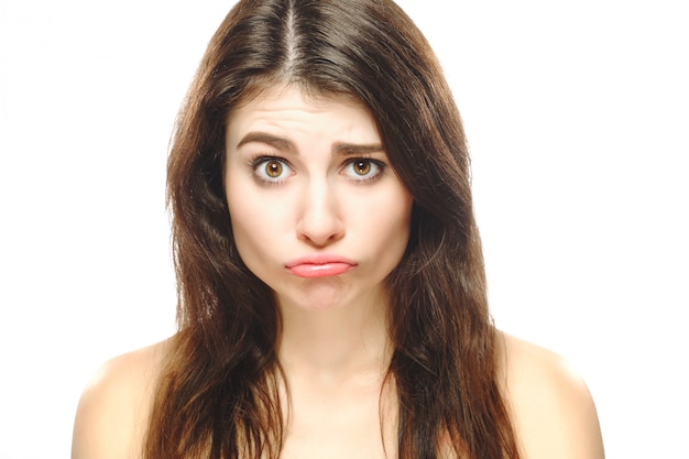 Premium Photo | Disappointed girl face closeup isolated