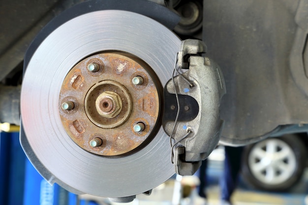 Premium Photo | Disc brakes on cars in process of new tires replacement ...