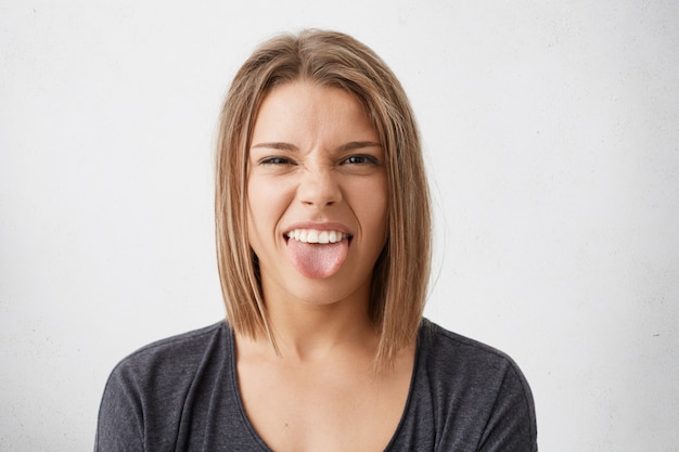 Free Photo Disgusted Pretty Girl Sticking Out Tongue Expressing Her 2724
