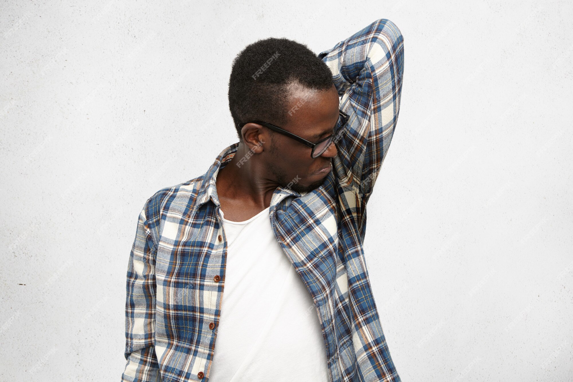 free-photo-disgusted-young-male-wearing-checkered-shirt-and-glasses