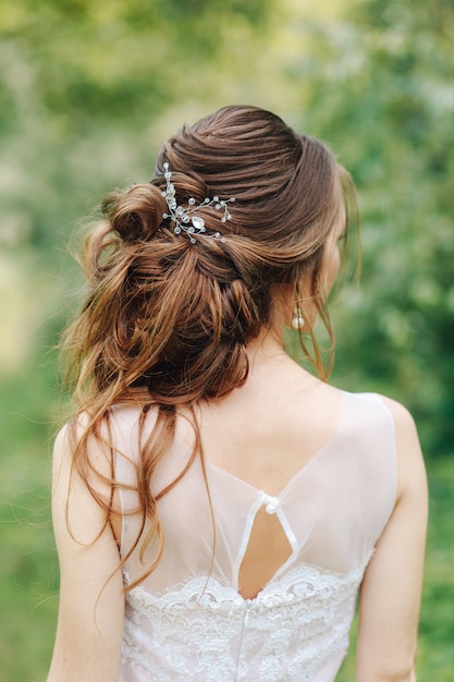 Premium Photo | Disheveled hairstyle on the bride with a small barrette ...