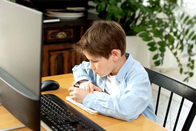 Premium Photo  Distance learning during isolation during quarantine in coronovirus. boy and 