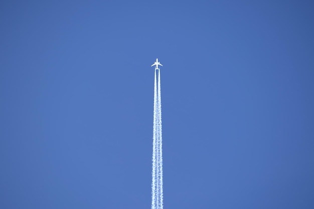 Premium Photo | Distant passenger jet plane flying on high altitude on ...