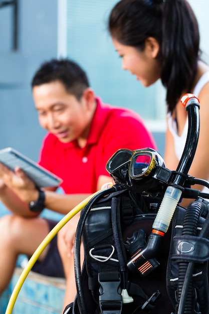 Premium Photo | Dive master and student in asian diving school