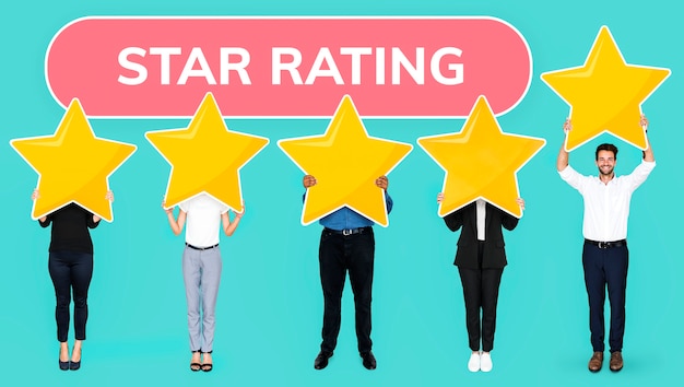 Diverse people showing golden star rating symbol Free Photo