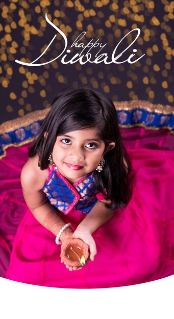 Premium Photo | Diwali greeting card showing cute little indian or ...