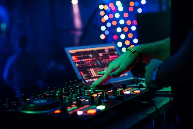 Premium Photo | Dj plays music on professional music equipment ...