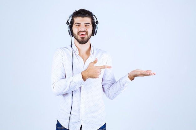 Free Photo | Dj with headphones dancing and pointing to somebody on the ...