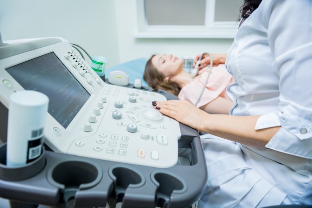 Premium Photo | Doctor using ultrasound scanning machine for examining