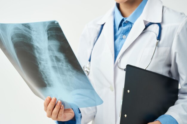 Premium Photo | Doctor in a white coat xrays of the lungs research work