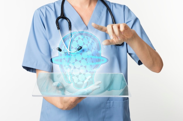 Doctors using transparent tablet with hologram medical technology Free Photo