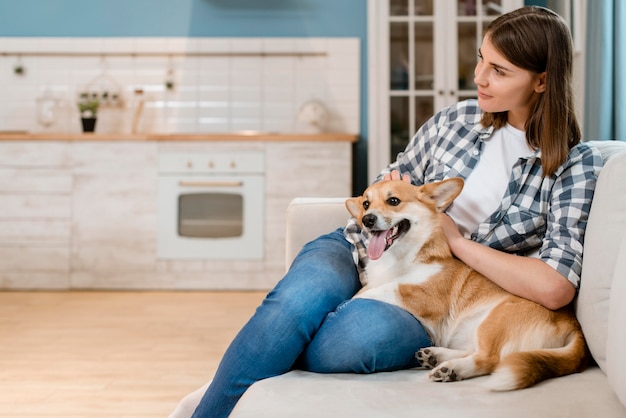 Free Photo | Dog and owner at home on the couch