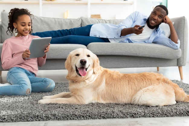 Premium Photo | Domestic life concept. cheerful black family resting at ...