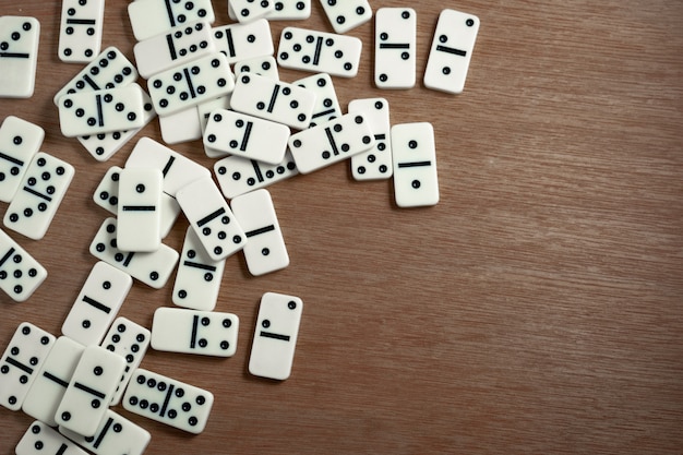 Domino chips with wooden background | Premium Photo