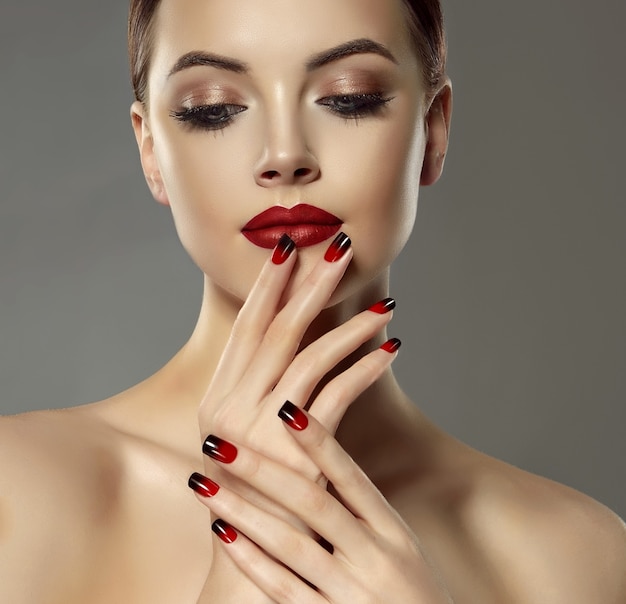 Premium Photo Double colored manicure on the slender fingers of ... photo