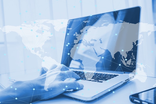 Double exposure using computer laptop doing business online network Premium Photo